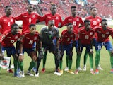Gambia players pose for a group photo before the match on January 12, 2022
