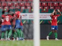 Gambia's Ablie Jallow celebrates scoring their first goal with teammates on January 12, 2022