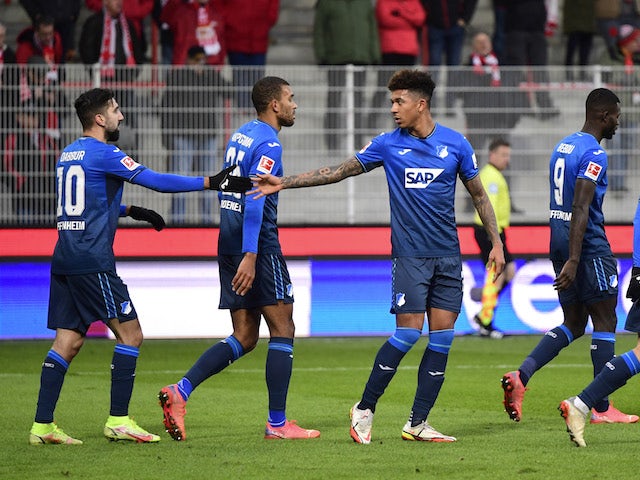 Hoffenheim players celebrate with teammates after Union Berlin's Timo Baumgartl scored an own goal on January 15, 2022