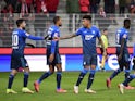 Hoffenheim players celebrate with teammates after Union Berlin's Timo Baumgartl scored an own goal on January 15, 2022