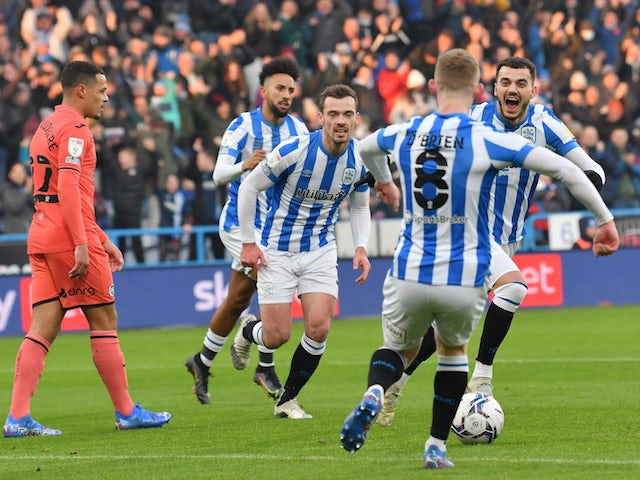 Huddersfield Town's Danel Sinani celebrates scoring their first goal with teammates on January 15, 2022
