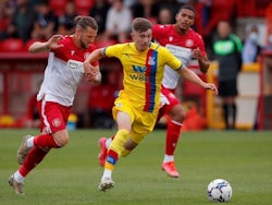 Crystal Palace's Jack Wells-Morrison in action with Stevenage's Jake Reeves, July 23, 2021