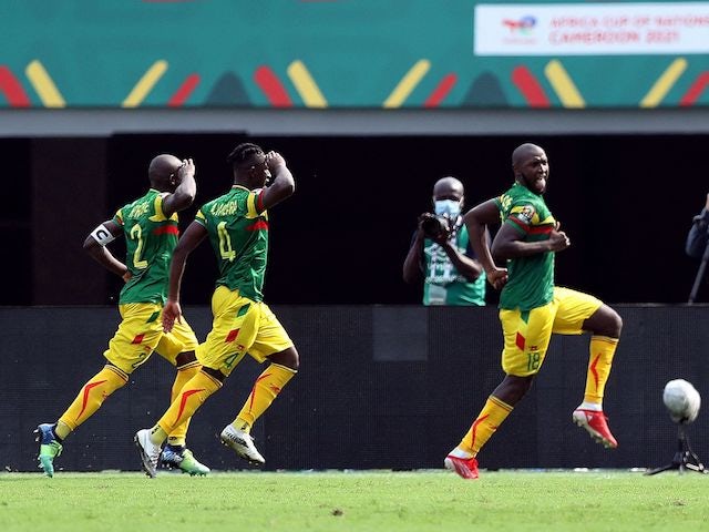 Mali's Ibrahima Kone celebrates scoring their first goal with Hamari Traore and Amadou Haidara on January 12, 2022
