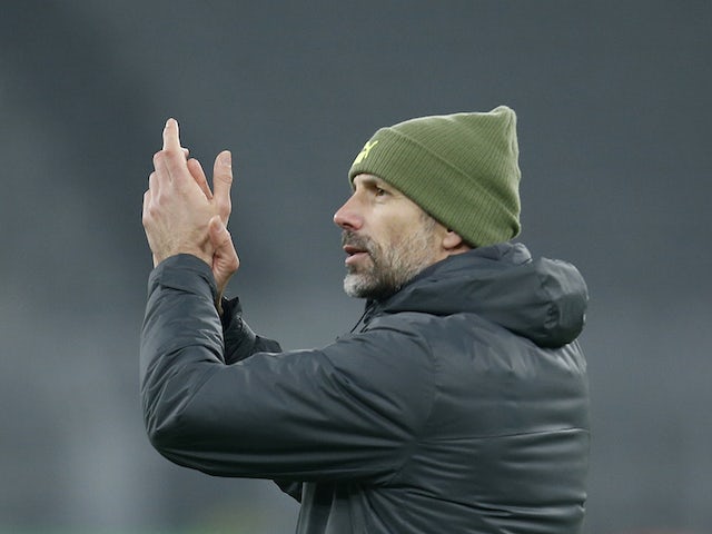 Borussia Dortmund coach Marco Rose applauds fans after the match on January 14, 2022