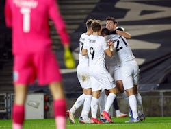 MK Dons' Matt O'Riley celebrates scoring their first goal with teammates on January 11, 2022