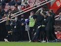 Moreirense players celebrate after Benfica's Gilberto scored an own goal and the first for them on January 15, 2022