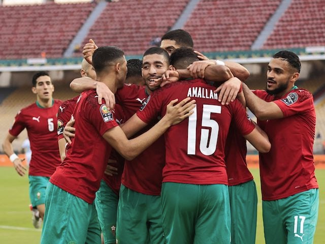 Morocco's Selim Amallah celebrates scoring their first goal with teammates on January 14, 2022