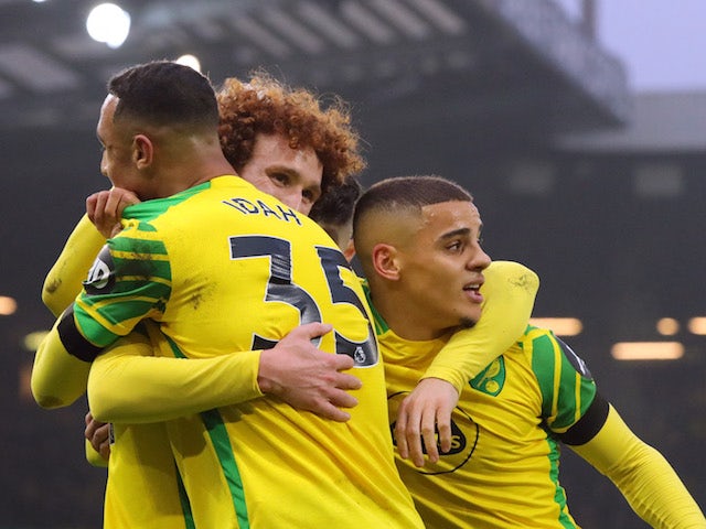Norwich City's Adam Idah, Max Aarons and Josh Sargent celebrate their first goal an own goal scored by Everton's Michael Keane on January 15, 2022