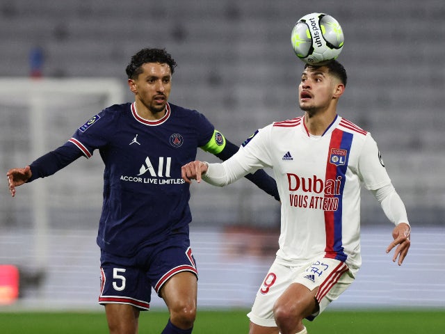 Paris St Germain's Marquinhos in action with Olympique Lyonnais' Bruno Guimaraes on January 9, 2022