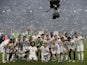 Real Madrid players celebrate with the trophy after winning the Spanish Super Cup on January 16, 2022