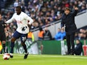 Tottenham Hotspur's Tanguy Ndombele in action as manager Antonio Conte looks on, January 9, 2022