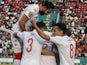 Tunisia's Hamza Mathlouthi celebrates scoring their first goal with teammates on January 16, 2022