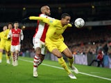 Liverpool's Joel Matip shields the ball from Arsenal's Alexandre Lacazette on January 20, 2022