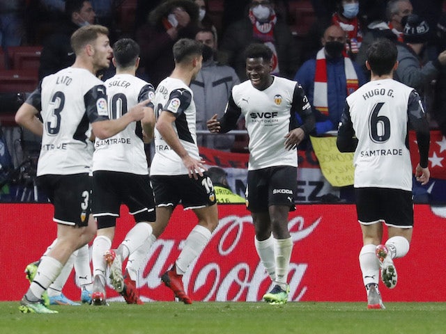 Valencia's Yunus Musah celebrates his first goal with his teammates on January 22, 2022