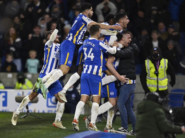 Brighton & Hove Albion's Adam Webster celebrates scoring their first goal with teammates and fans on January 18, 2022