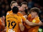 Hull City's Ryan Longman celebrates scoring their first goal with teammates on January 22, 2022