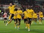 Wolverhampton Wanderers' Joao Moutinho celebrates scoring their first goal with Tote Gomes on January 22, 2022