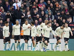 Liverpool's Virgil van Dijk celebrates scoring their first goal with teammates on January 23, 2022
