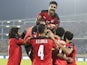 Egypt's Mohamed Abdelmonem celebrates scoring their first goal with teammates on January 19, 2022