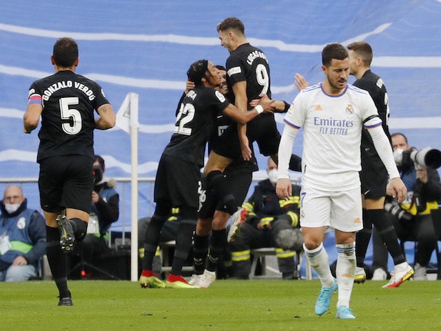 Elche's Lucas Boye celebrates scoring their first goal with teammates as Real Madrid's Eden Hazard reacts on January 23, 2022