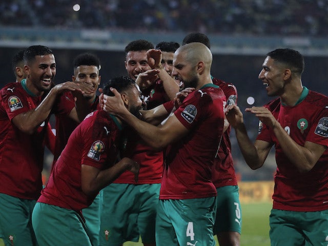 Morocco's Sofiane Boufal celebrates scoring their first goal with teammates on January 18, 2022