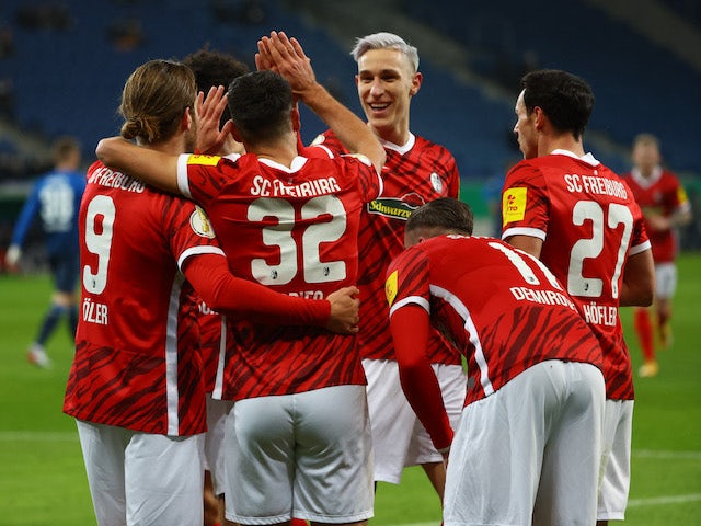 Freiburg's Vincenzo Grifo celebrates scoring their first goal with teammates on January 19, 2022