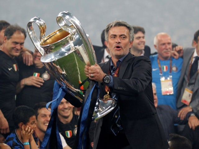 Inter Milan's manager Jose Mourinho celebrates with the Champions League trophy on May 22, 2010