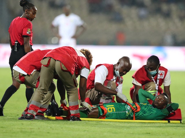 Zimbabwe's Kudakwashe Mahachi receives medical attention after sustaining an injury on January 18, 2022