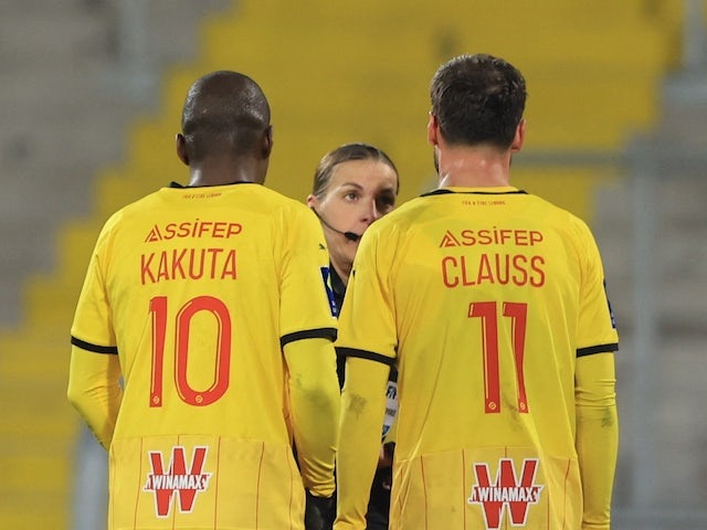 Referee Stephanie Frappart talks to RC Lens' Gael Kakuta and Jonathan Clauss on January 22, 2022