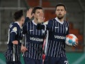 Bochum's Milos Pantovic celebrates scoring their first goal with teammates on January 18, 2022