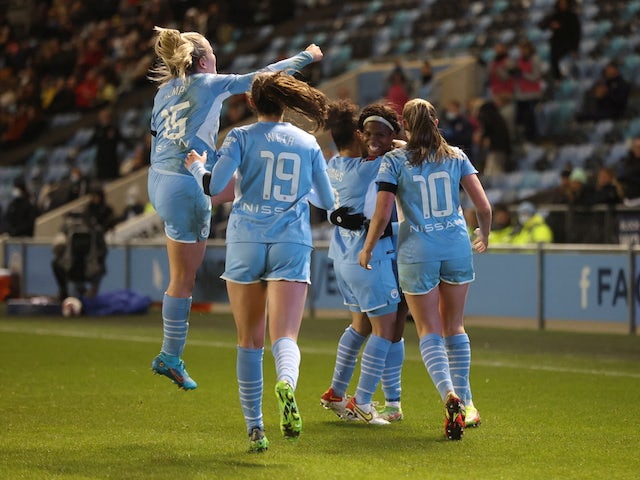 Manchester City Women's Khadija Shaw celebrates scoring their first goal with teammates on January 23, 2022
