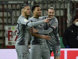 St Pauli's Etienne Amenyido celebrates scoring their first goal with Leart Paqarada and Jackson Irvine on January 18, 2022