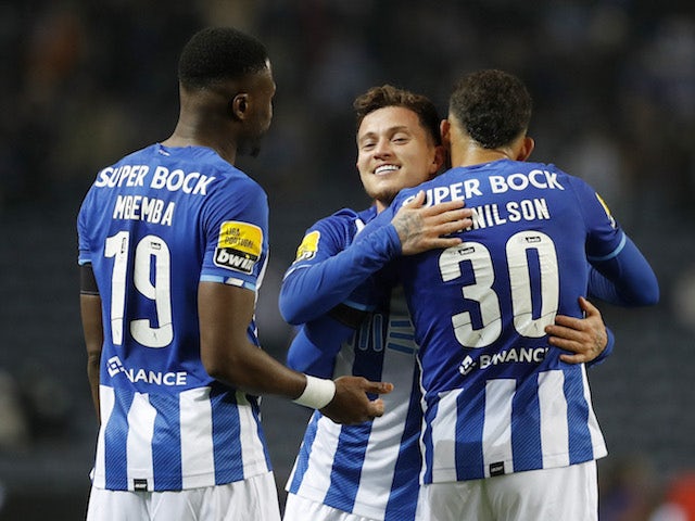 Porto's Otavio celebrates scoring their first goal with Evanilson and Chancel Mbemba on January 23, 2022