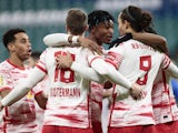 RB Leipzig's Yussuf Poulsen celebrates scoring their first goal with teammates on January 19, 2022