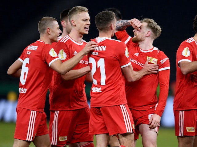 Union Berlin's Andreas Voglsammer celebrates scoring their first goal with teammates on January 19, 2022