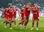 Union Berlin's Max Kruse celebrates scoring their first goal with Grischa Promel and teammates on January 22, 2022