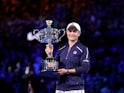 Australia's Ashleigh Barty poses as she celebrates winning the final against Danielle Collins of the U.S. with the trophy on January 28, 2022