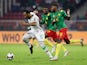 Comoros' Rafidine Abdullah in action with Cameroon's Karl Toko-Ekambi at the Africa Cup of Nations on January 24, 2022