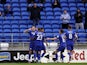 Cardiff City's Jordan Hugill celebrates scoring their first goal with Cody Drameh and Max Watters on January 30, 2022