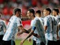 Argentina's Angel Di Maria celebrates scoring their first goal with teammates on January 27, 2022