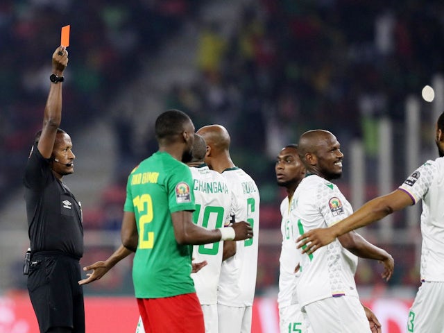 Comoros' Nadjim Abdou is shown a red card by referee Bamlak Tessema Weyesa after a VAR review on January 24, 2022
