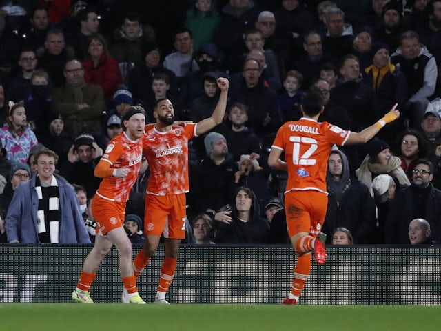Blackpool's Josh Bowler celebrates his first goal against Christopher Hamilton on 29 January 2022