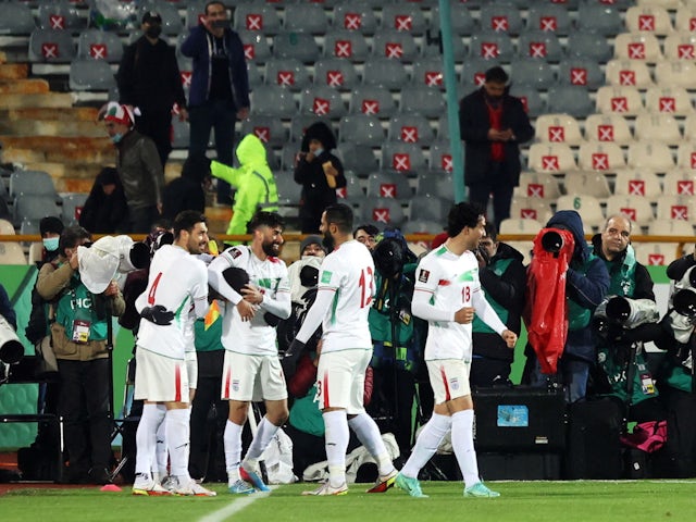 Iran's Mehdi Taremi celebrates scoring their first goal with teammates on January 27, 2022