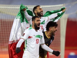 Iran's Saman Ghoddos and Hossein Kanani celebrate after qualifying for the World Cup on January 27, 2022