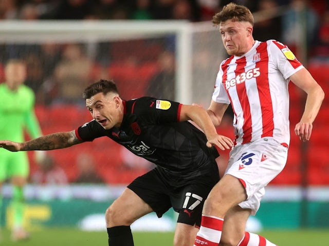 Harry Suter of Stoke City against Jordan Hagill of West Bromwich Albion on 1 October 2021