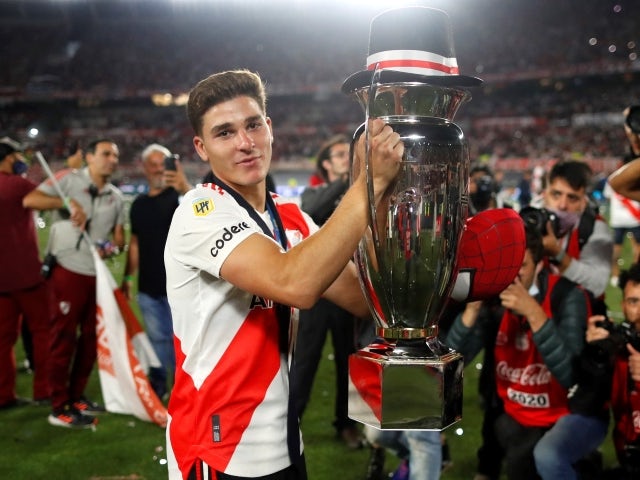 River Plate's Julian Alvarez celebrates winning the Argentina Primera Division with the trophy on November 25, 2021