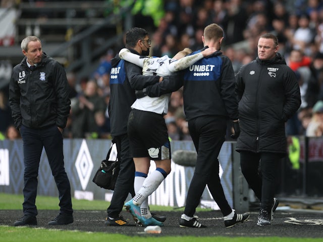 Derby County's Kamil Jozwiak walks off the pitch after sustaining an injury on January 30, 2022