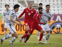Lebanon's Hassan Maatouk and George Felix Michel in action with South Korea's Jung Woo-Young on January 26, 2022
