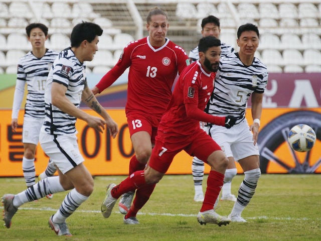 Lebanon's Hassan Maatouk and George Felix Michel in action with South Korea's Jung Woo-Young on January 26, 2022