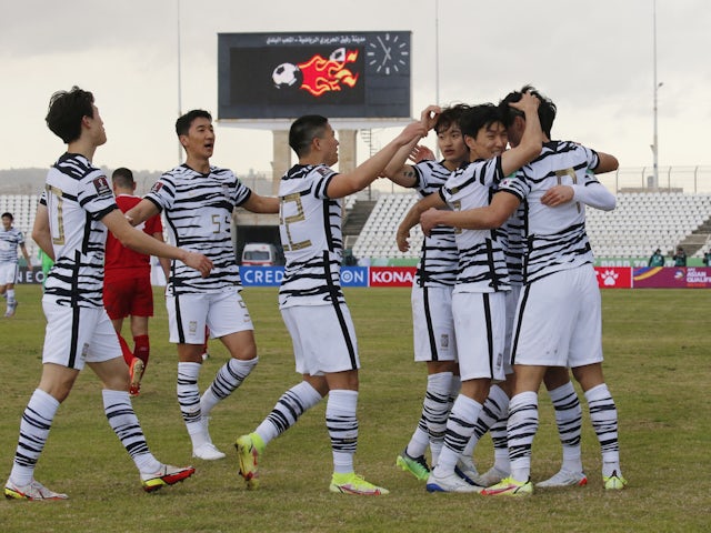 South Korea's Cho Gue-Sung celebrates scoring their first goal with teammates on January 27, 2022